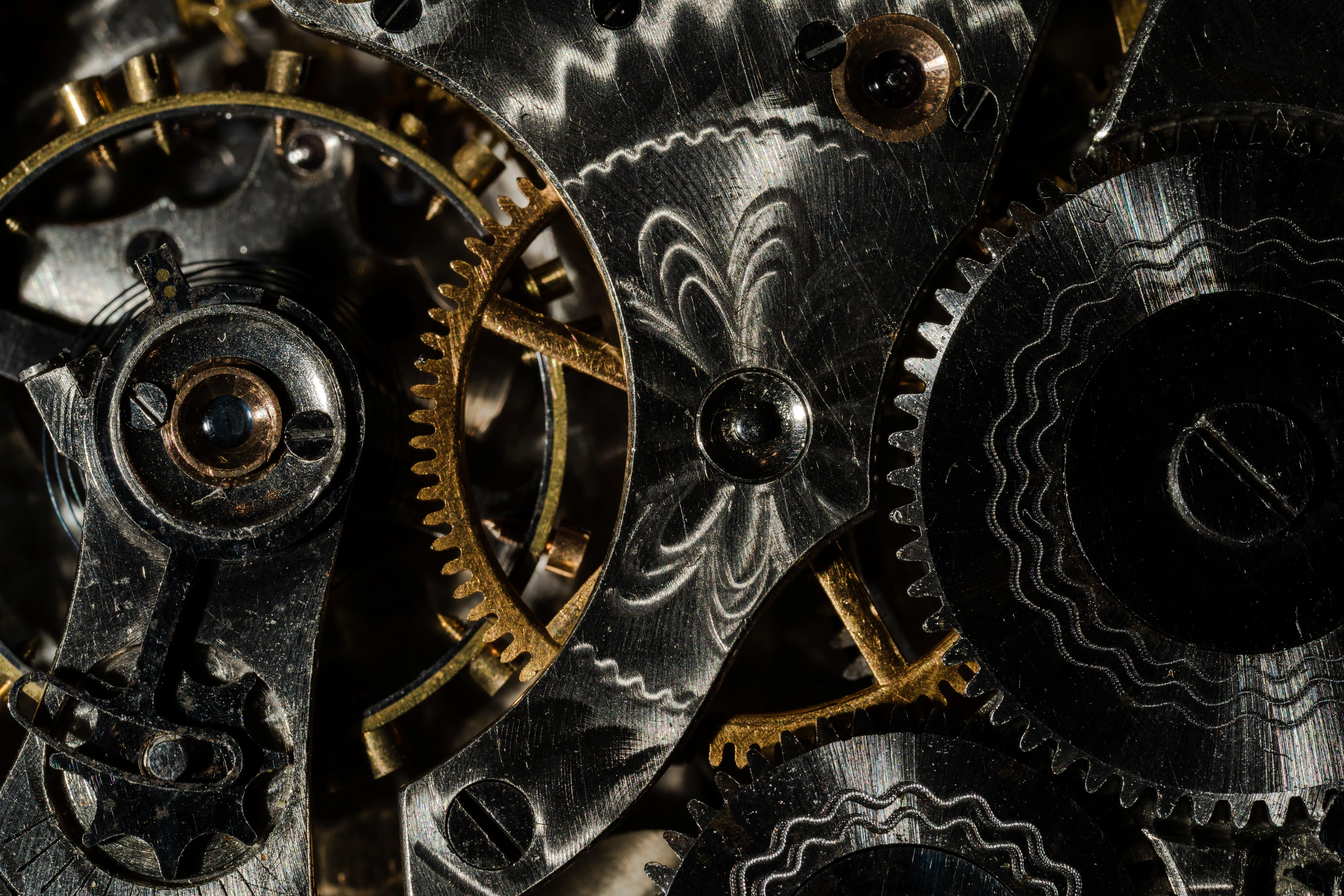 Close-up view of the gears inside an antique watch.