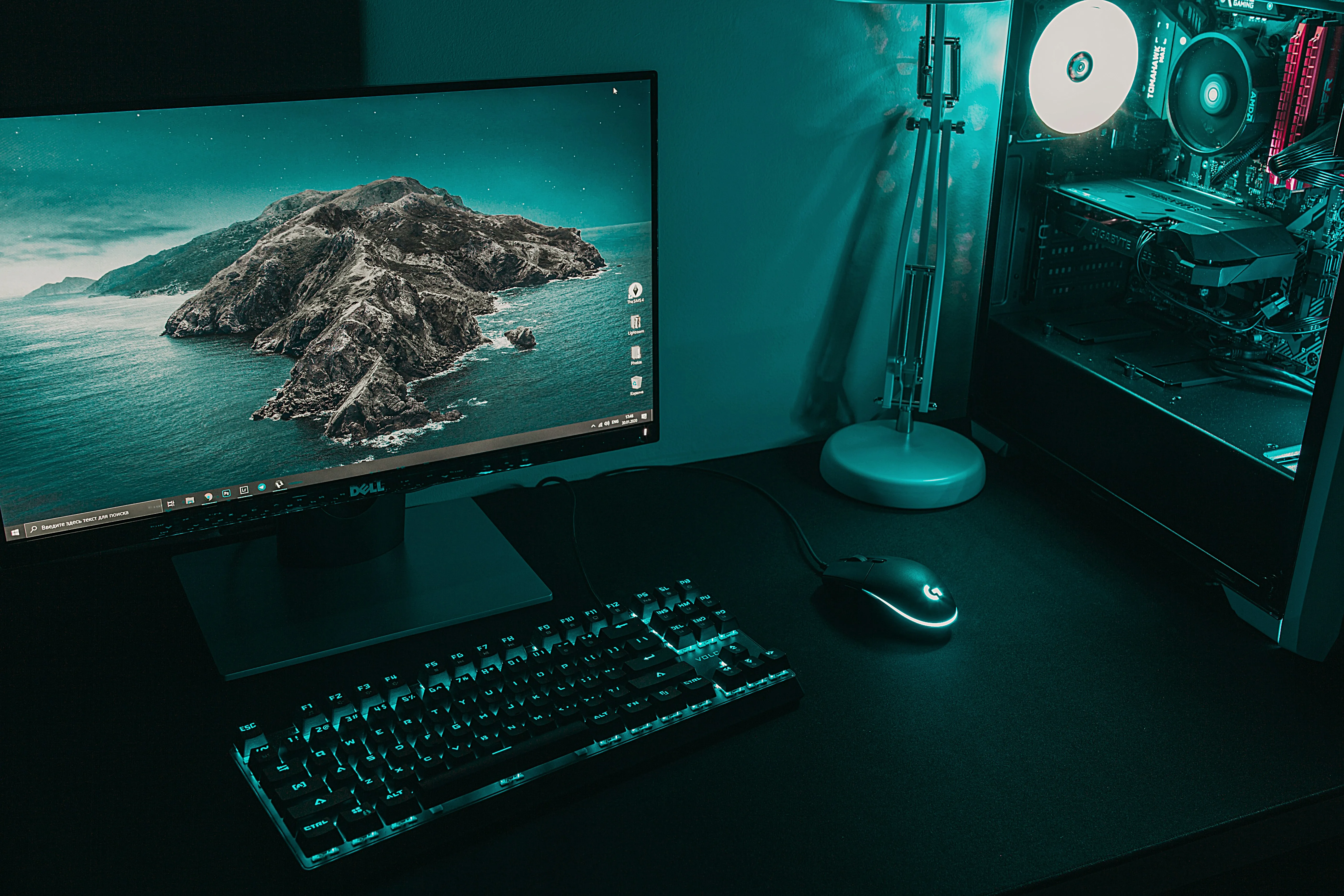 A desktop PC workstation with monitors and peripherals.